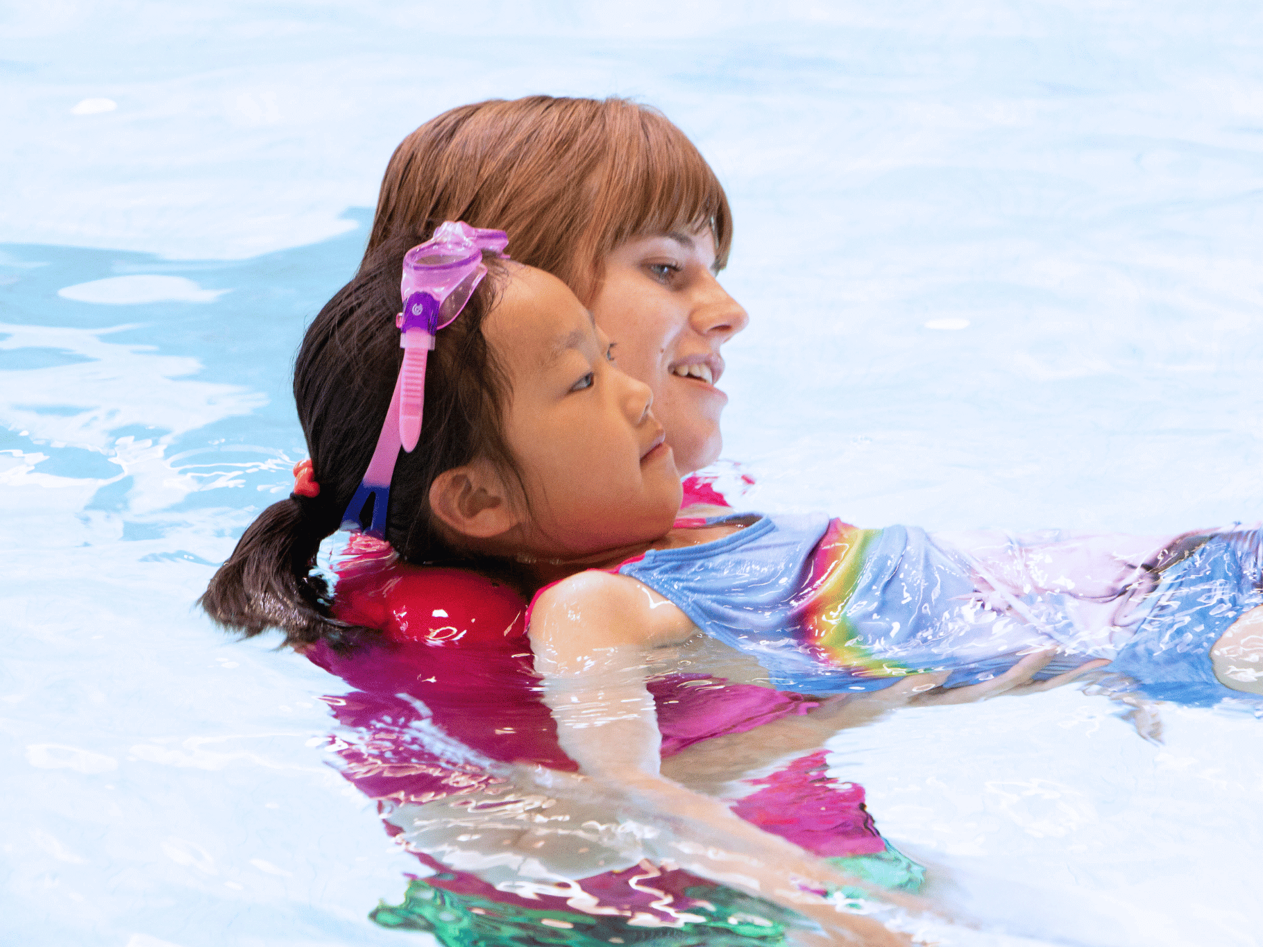 child taking swim lessons