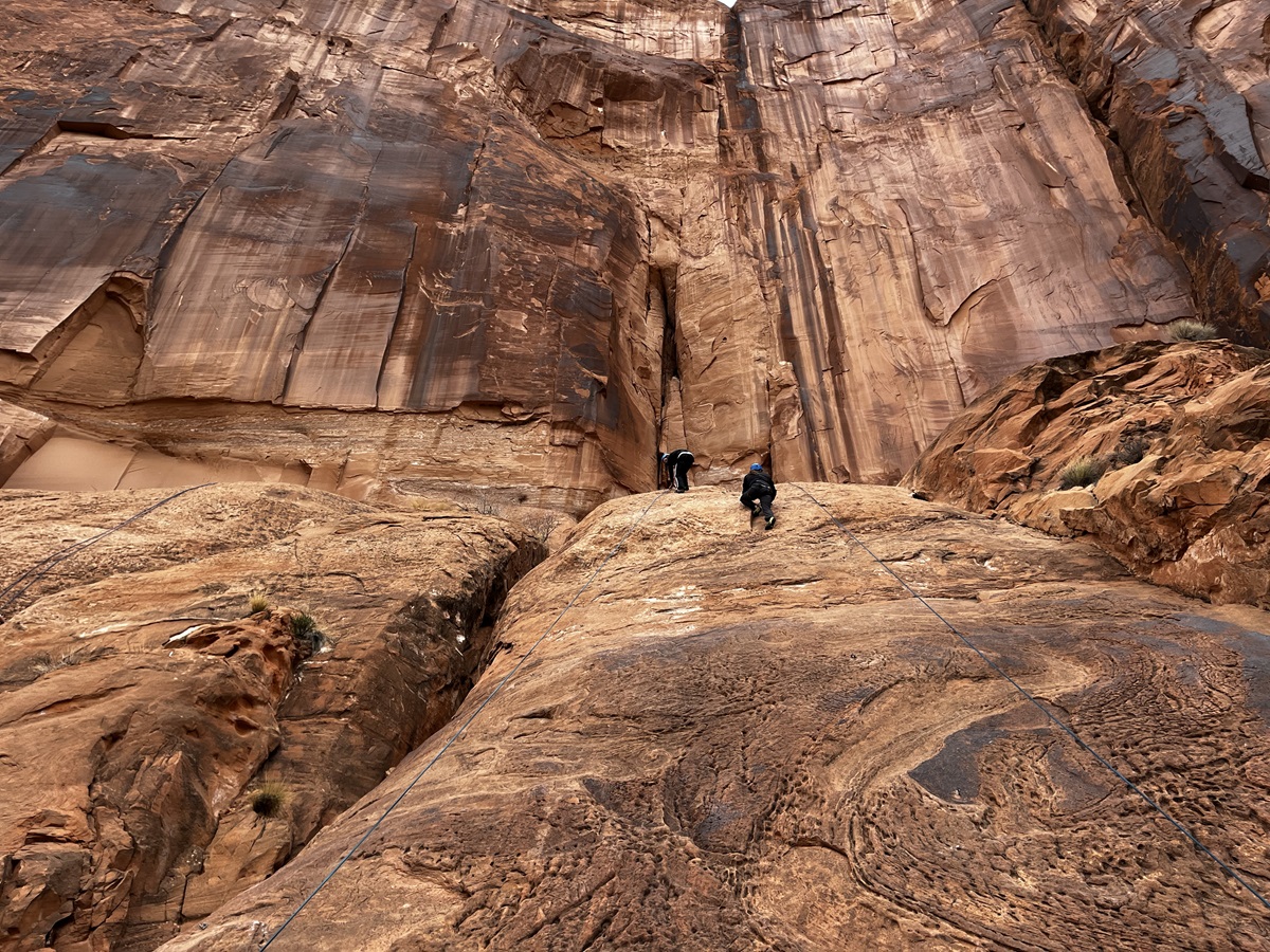 people rock climbing