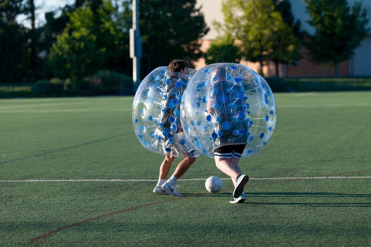 people playing bubble soccer