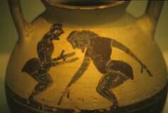 Corinthian vase depicting early comic characters (click to see larger image)