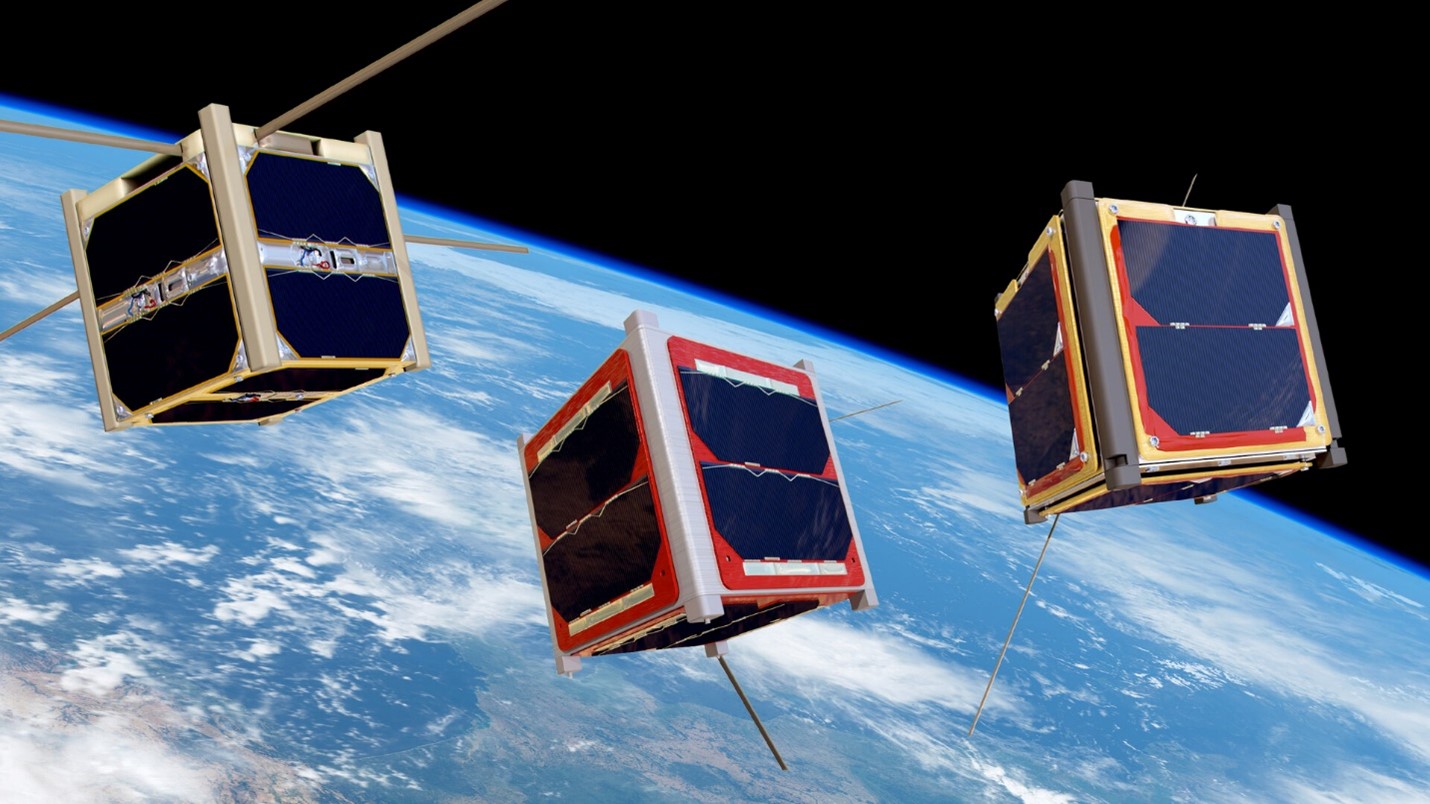 Three CubeSats with a space background