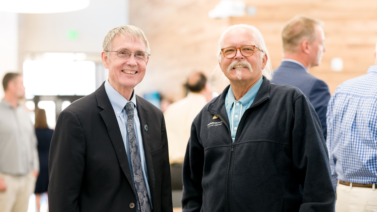 Executive Vice President and Provost Frank Galey and Vice Provost for Statewide Campuses RIchard C. Etchberger pose for a picture at the Moab Campus ribbon cutting event.