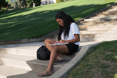 student studying on steps