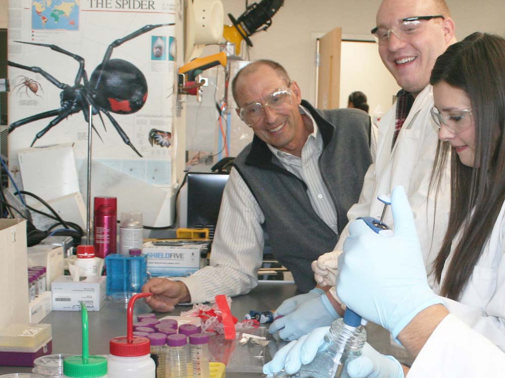 Randy Lewis with researchers in the spider silk lab