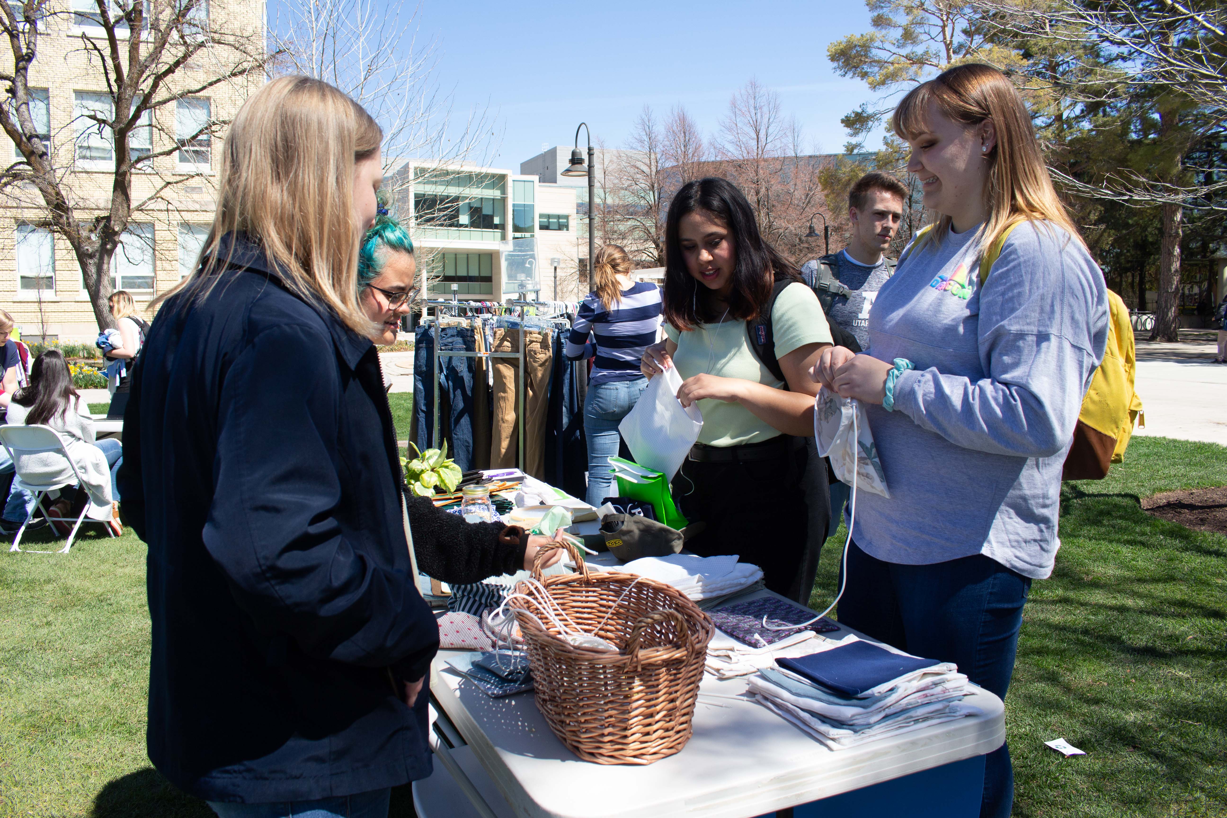 Students visit an informational table on campus