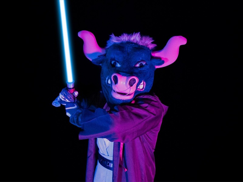 USU mascot Big Blue poses with a light saber in a Jedi costume