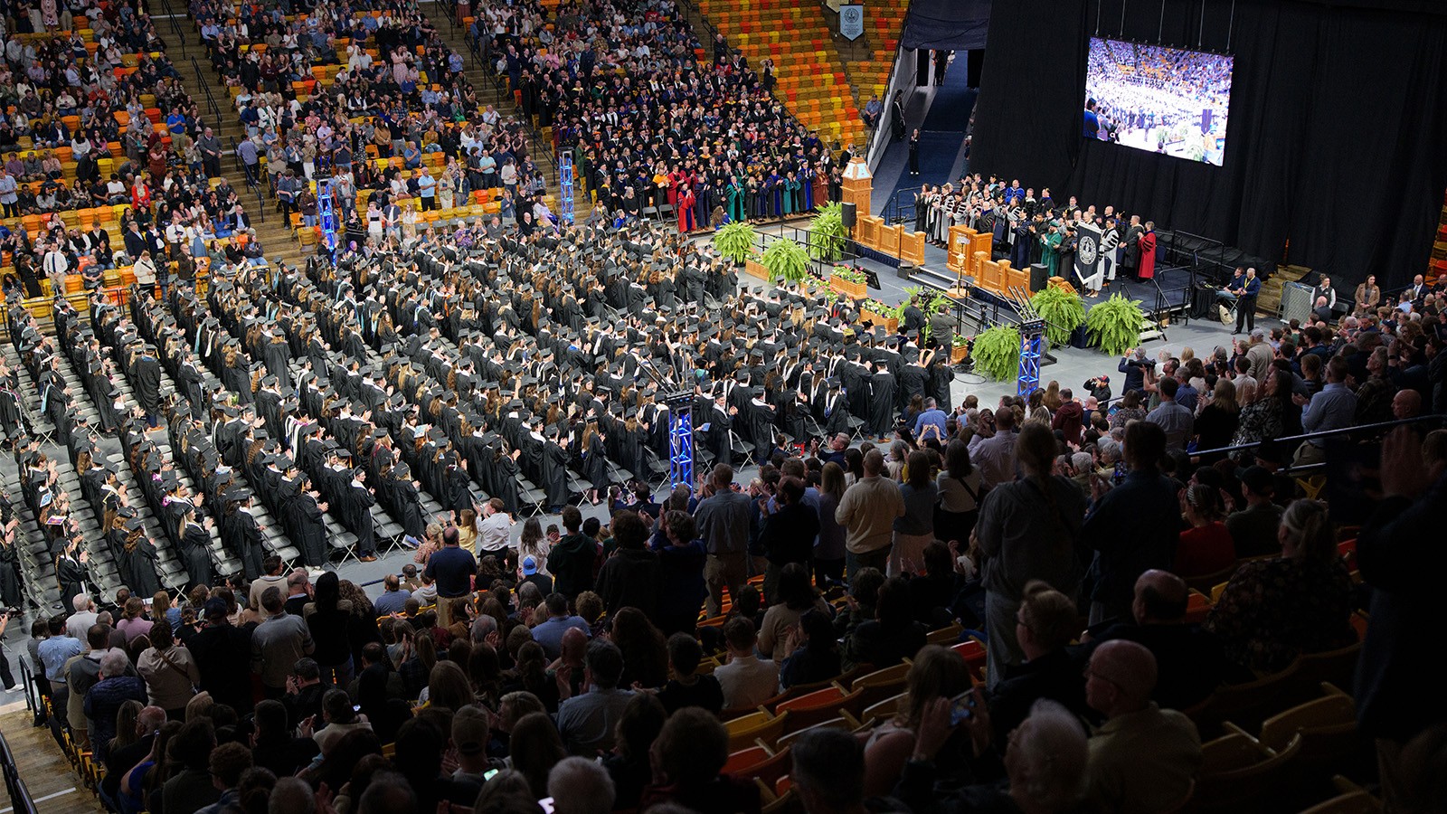 Bird's eye view of USU's Spectrum filled with students for commencement